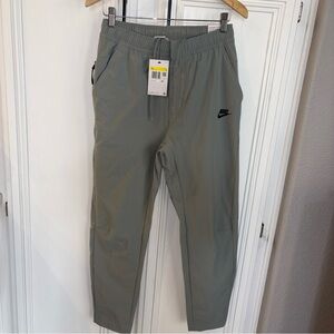 NWT Nike Sportswear Commuter Pants Men’s Sz S Green Slim Tech Woven Performance